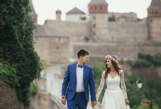 Couple in love walking near castle