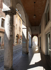 The galleries on the first floors of houses along streets in the historic center of Padua, Italy.