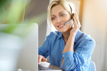 Sales representative woman working from home-office