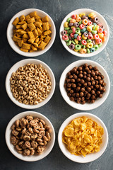 Variety of cold cereals in white bowls