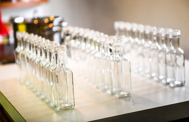 Set of small transparent plastic bottles ready to be filled.