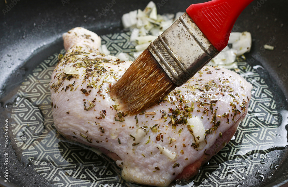 Sticker chicken with herbs prepared for baking