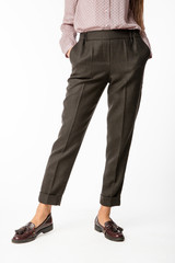Details of women's clothing. Women's pants model on a white background