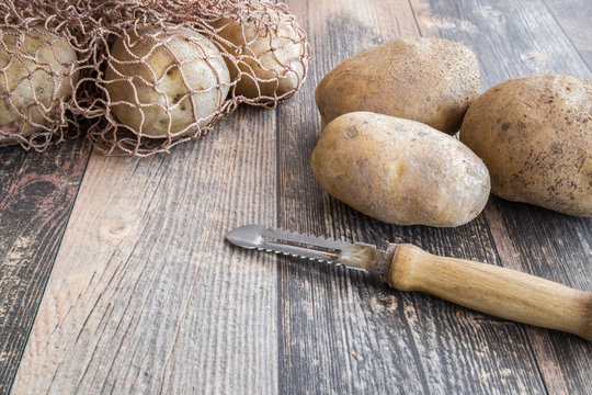 Potatoes on the wooden table. Healthy eating and lifestyle.