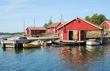 Fototapeta na wymiar Fisherman huts at the Scandinavian east coast in Summer