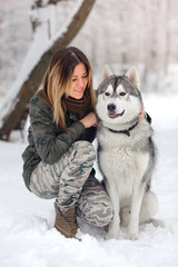 beautiful girl with huskies