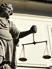 Statue of archangel Michael, angel of justice, with golden scales in front of town hall in Banska...