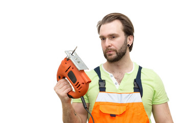  man in overalls with a jigsaw