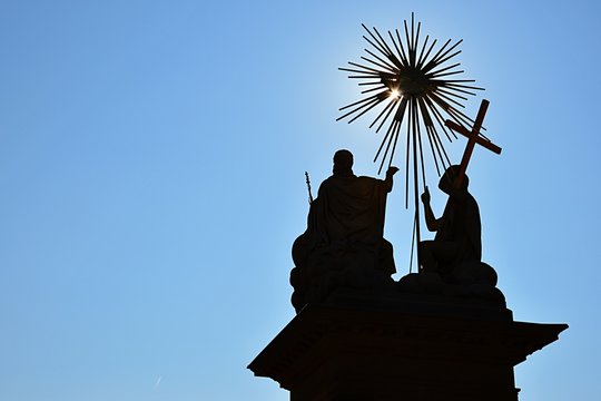 Silhouette of God the Father, Jesus Christ and Holy Spirit on The Holy Trinity column in Nova Bana, Slovakia
