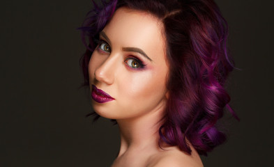 Portrait of beautiful sexy fashion model with purple hair over g