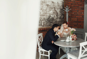 Couple in love drinks a tea in restaurant