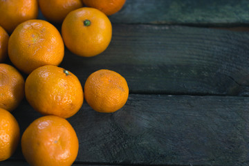 Fresh tangerine on a wooden background