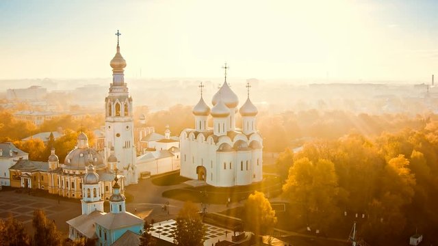 Aerial view of orthodox church in the old city Vologda in the russian north during foggy sunset.