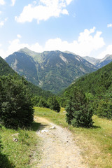 Fototapeta na wymiar Aigüestortes National Park in the Catalan Pyrenees, Spain. The main crest of Pyrenees forms a divide between France and Spain, with the microstate of Andorra sandwiched in between