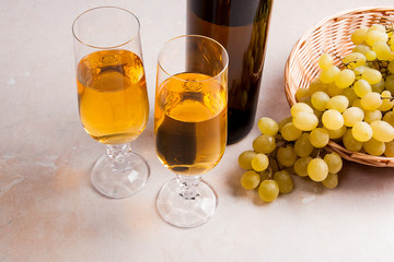 White wine and grapes. White wine in glasses, bottle of wine and