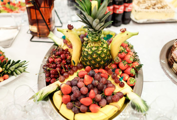 Fototapeta na wymiar Plate with fruit on the buffet table