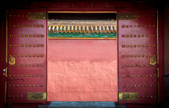 Ancient red wooden doors at the Forbidden City, Beijing