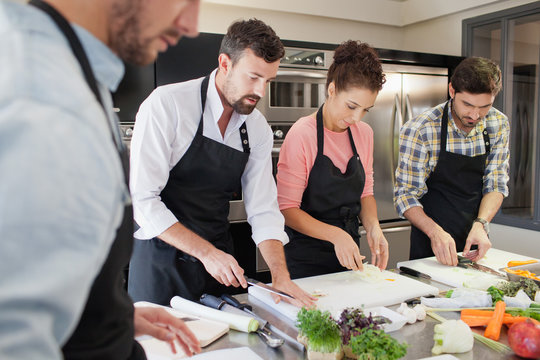 Chefs working at kitchen.