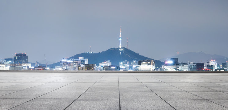 cityscape and skyline of seoul from empty brick floor