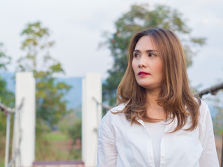 Asian Woman wearing white shirt , On a sunny days.