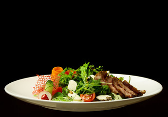 Green salad with baked meat