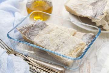 salted raw dry cod fish on dish
