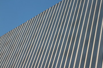 Fototapeta na wymiar Blank corrugated metal advertising hoarding with blue sky in corner.blue sky.