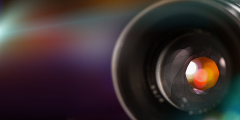 Camera lens with bokeh background.