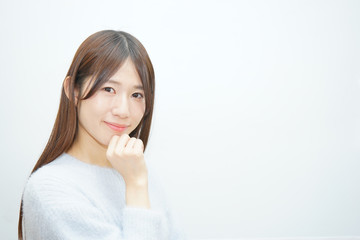 Young woman thinking something with white background