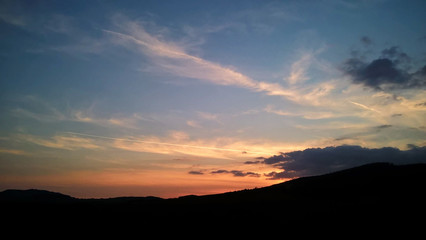 Sunset and sunrise with dramatic colorful clouds. Slovakia