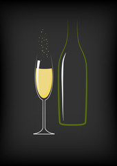 Glass of champagne and bottle