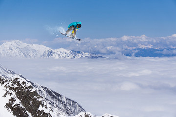 Flying snowboarder on mountains
