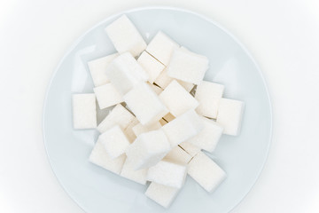 Marshmallow on a blue plate on a light background