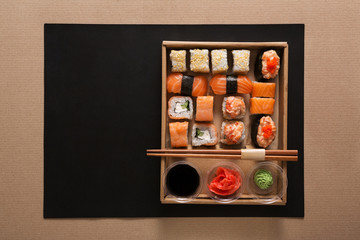 Set of sushi maki and rolls in carton delivery box