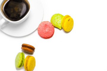 Coffee and colorful macaron on a white background. Isolated