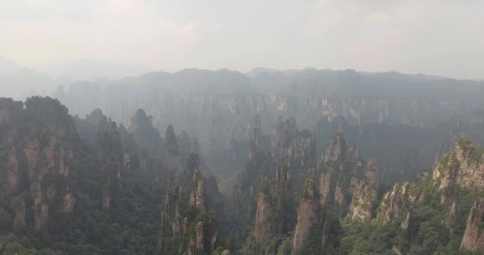 Aerial view of karst pillars at Wulingyuan National Park in China. Located in Historic Interest Area which was designated a UNESCO World Heritage Site as well as an AAAAA scenic area in China.