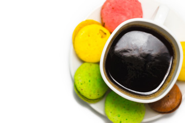 Coffee and colorful macaron on a white background. Isolated
