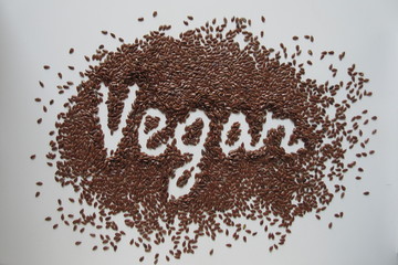 Vegan written on the pile of linseed