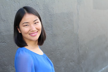 Obraz na płótnie Canvas Asian woman with a perfect white smile