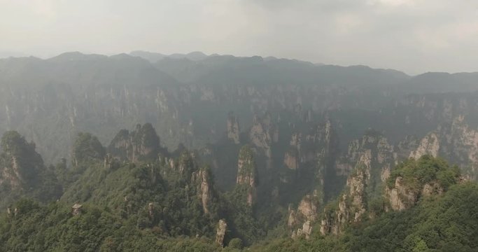 Aerial view of karst pillars at Wulingyuan National Park in China. Located in Historic Interest Area which was designated a UNESCO World Heritage Site as well as an AAAAA scenic area in China.