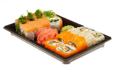 Roll sushi on a plate isolated on white background.