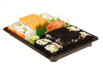 Roll sushi on a plate isolated on white background.