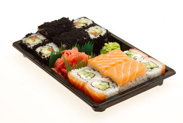 Roll sushi on a plate isolated on white background.