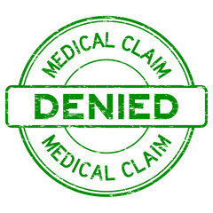 Grunge green medical claim denied round rubber stamp on white ba
