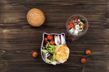 Wooden table covered with boxes and tomatoes