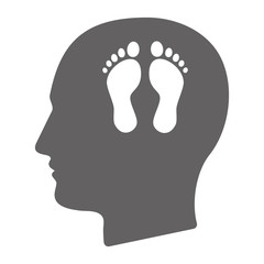 Isolated male head with two footprints