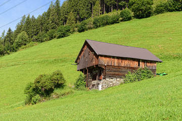 Fototapeta na wymiar traditional old wooden barn in zillertal alps in tirol/ austria