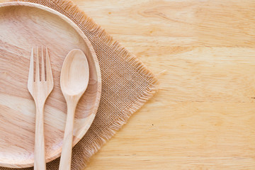 Wooden kitchenware on wooden table background