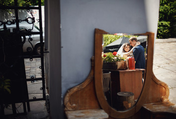 Newlyweds reflected in the mirror