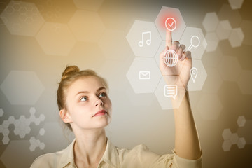 Girl pushing the button. Innovative technology concept